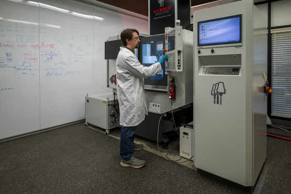 Scientist using the Hybrid Manufacturing AMBIT™